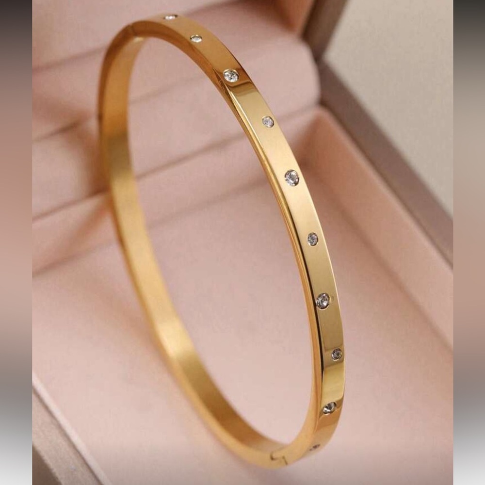 Elegant Gold Bangle with Silver Accents